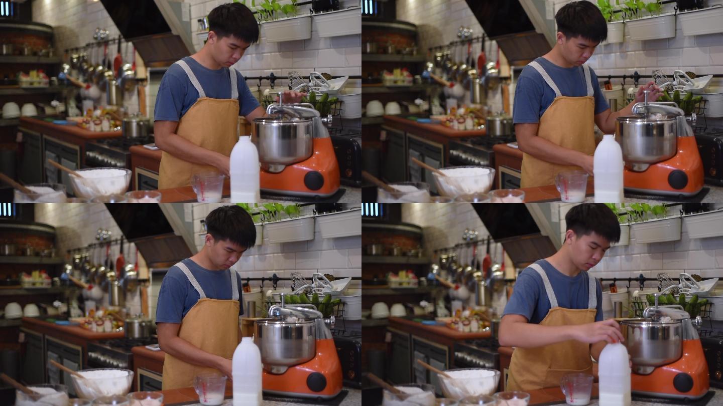 亚洲华人面包师少年男孩在厨房用立式搅拌机调整面粉