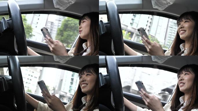 亚洲女性在城市使用智能手机和开车