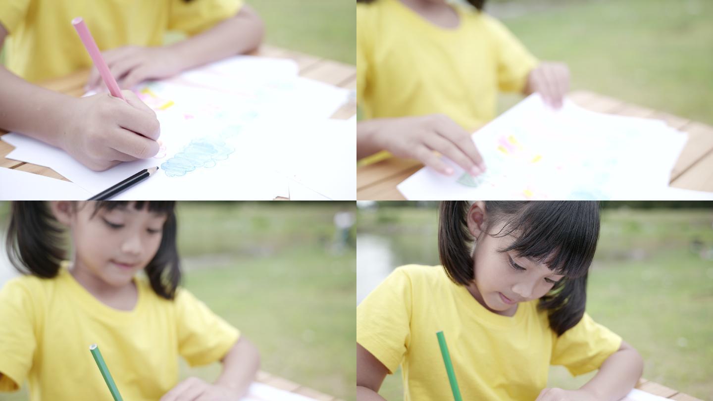 儿童用彩色铅笔在纸上画卡通的场景，教育背景