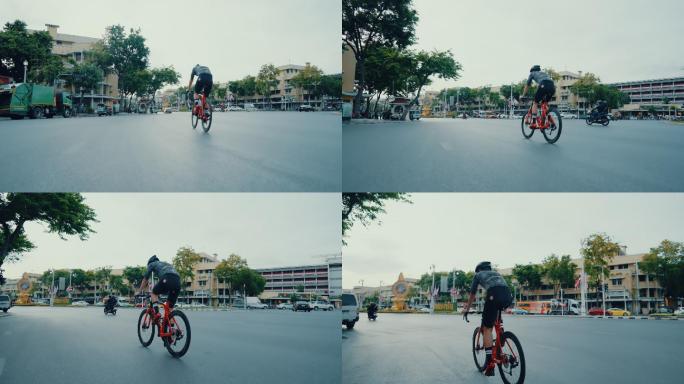 坚定的骑手在城市里骑着他的公路自行车。