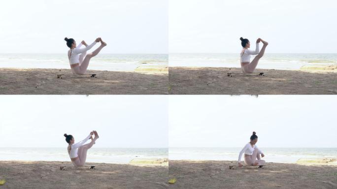 那个女人穿着运动服在海滩上练瑜伽。
