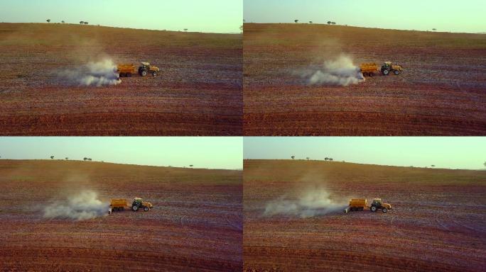 土壤施用石灰鸟瞰图-用于耕作和牧场施用石灰的农用拖拉机。使用土壤添加剂