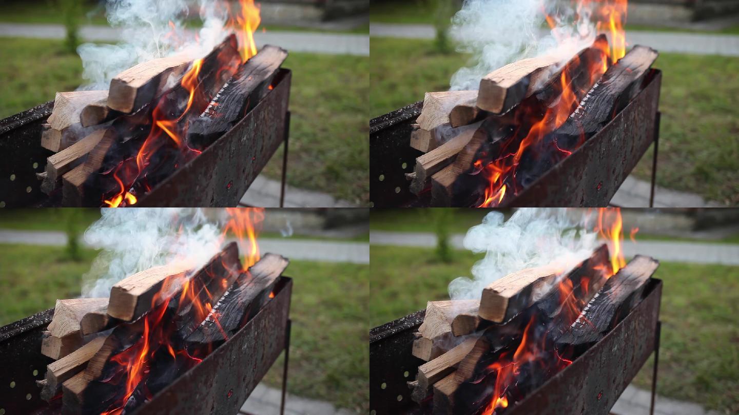 露天带火烧烤架。火焰，火焰