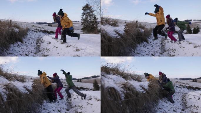 冬天，孩子们在宽阔的路上跳过沟渠
