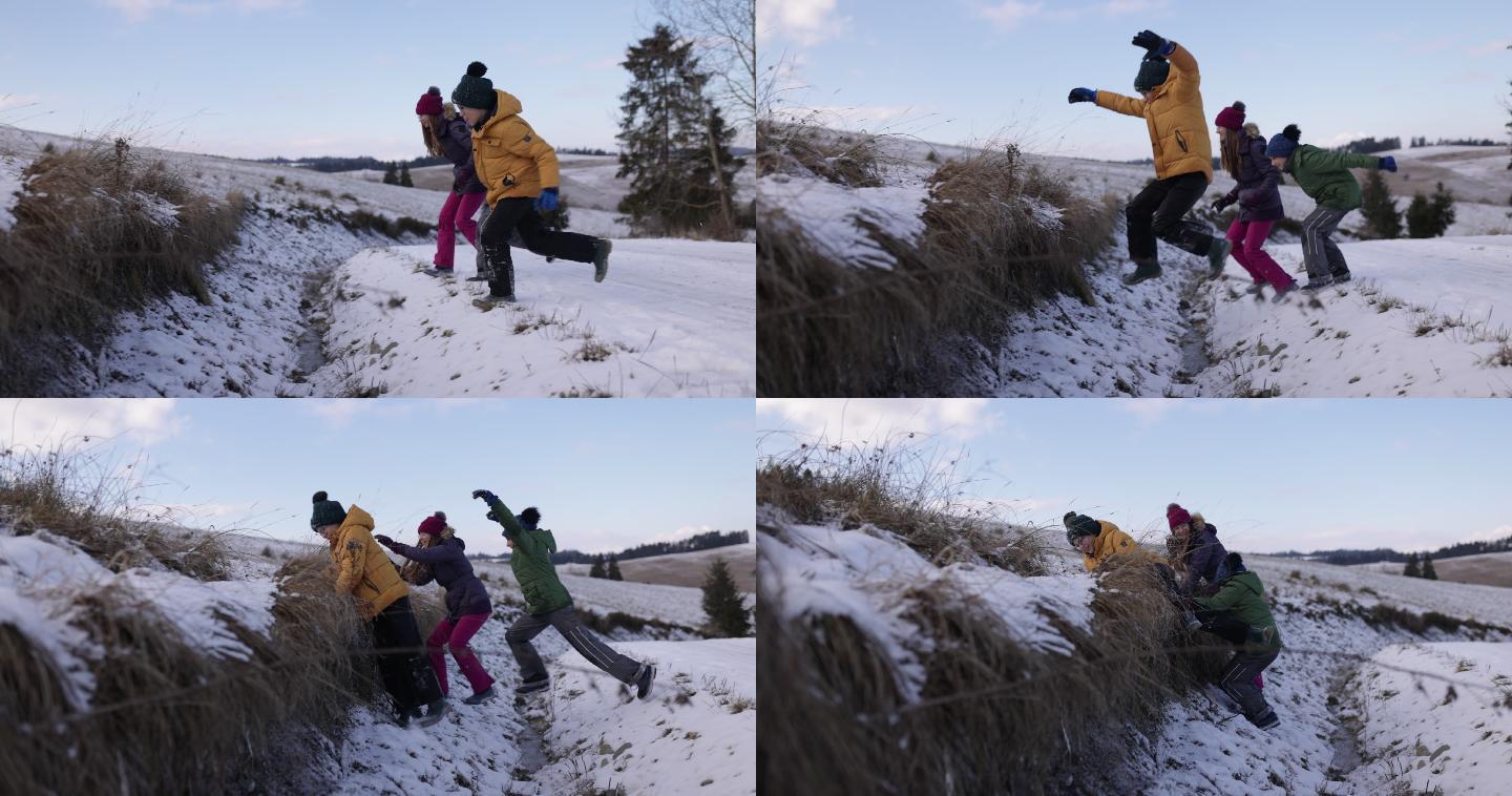 冬天，孩子们在宽阔的路上跳过沟渠