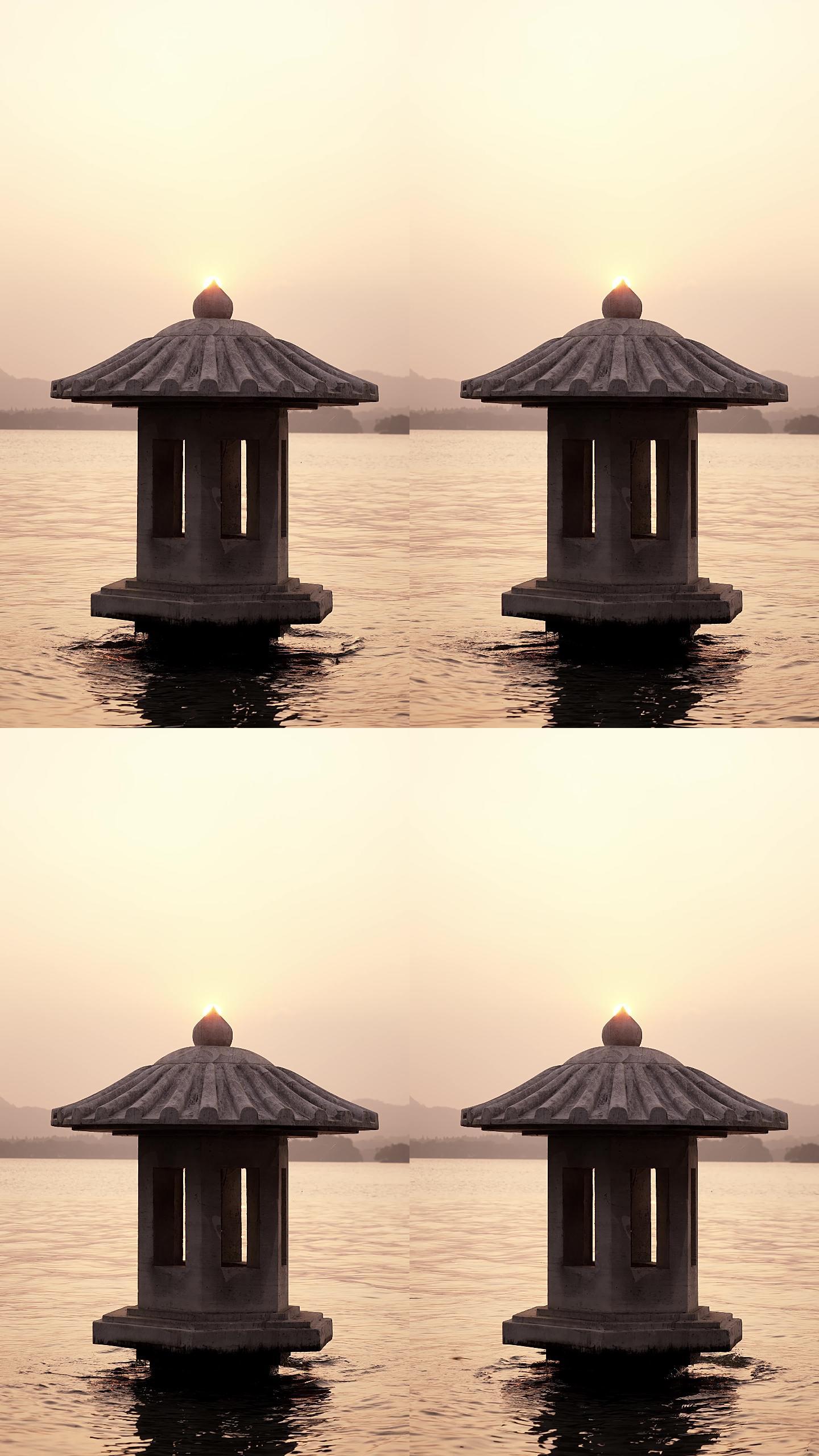 夕阳下波光粼粼的西湖和灯塔
