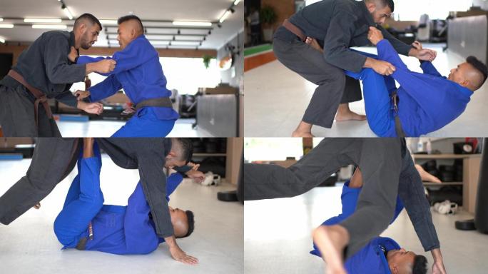 两名男子柔道练习者在体育馆内打斗