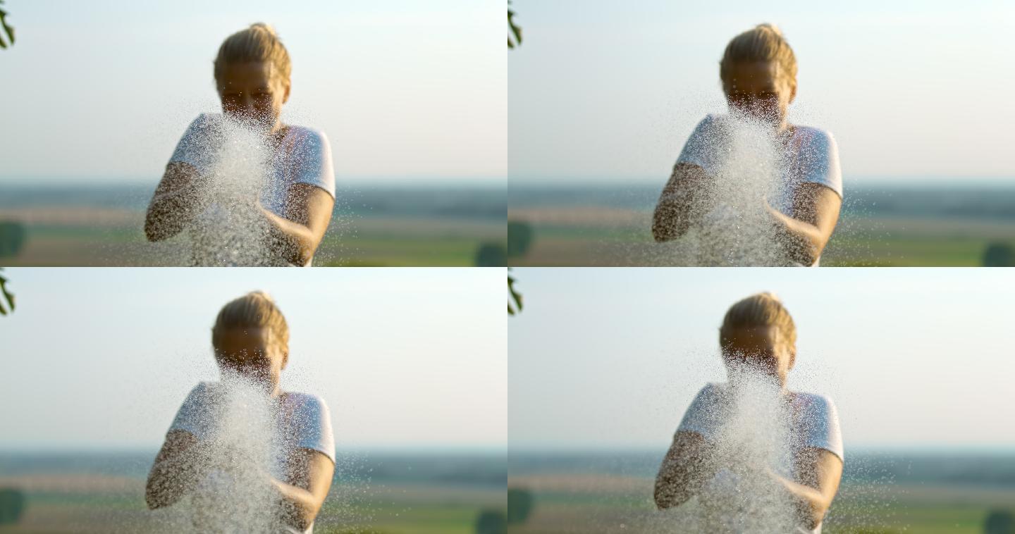 超级SLO MO时间扭曲效果女性喜欢在镜头前喷水