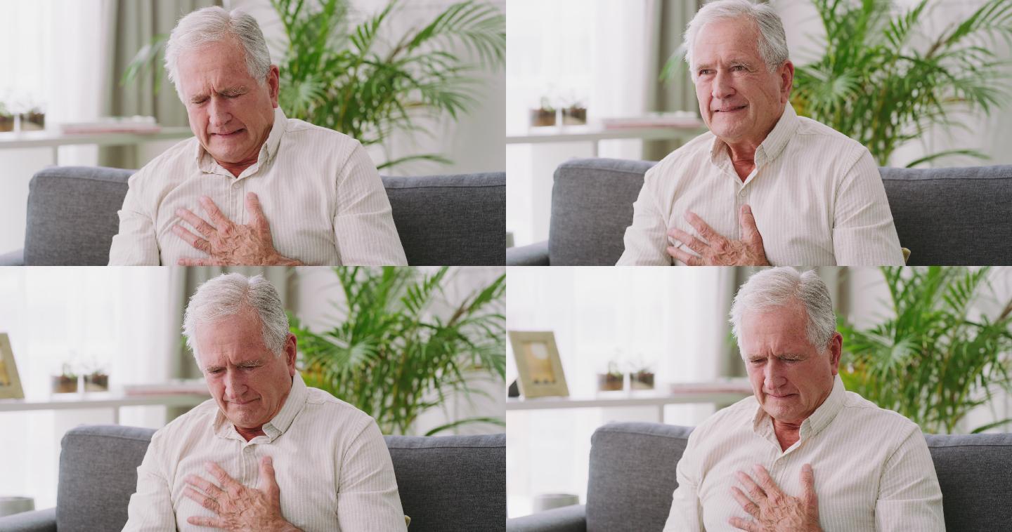 一名老年男子坐在家中沙发上时胸痛的4k视频片段