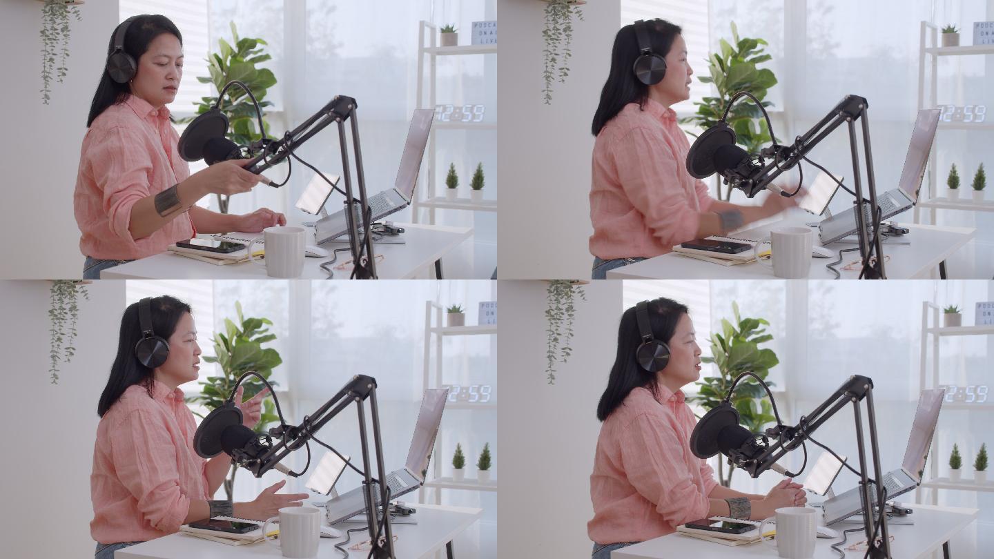 亚洲女性电台主持人用耳机和麦克风在笔记本电脑上录制播客。女播客在家里的工作室为在线节目制作音频播客。