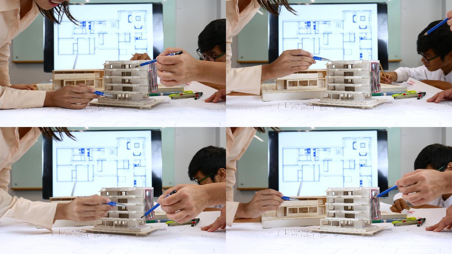 定义办公室建筑模型细节的建筑师团队