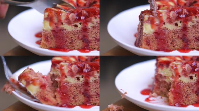 用叉子切草莓蛋糕家庭烘培