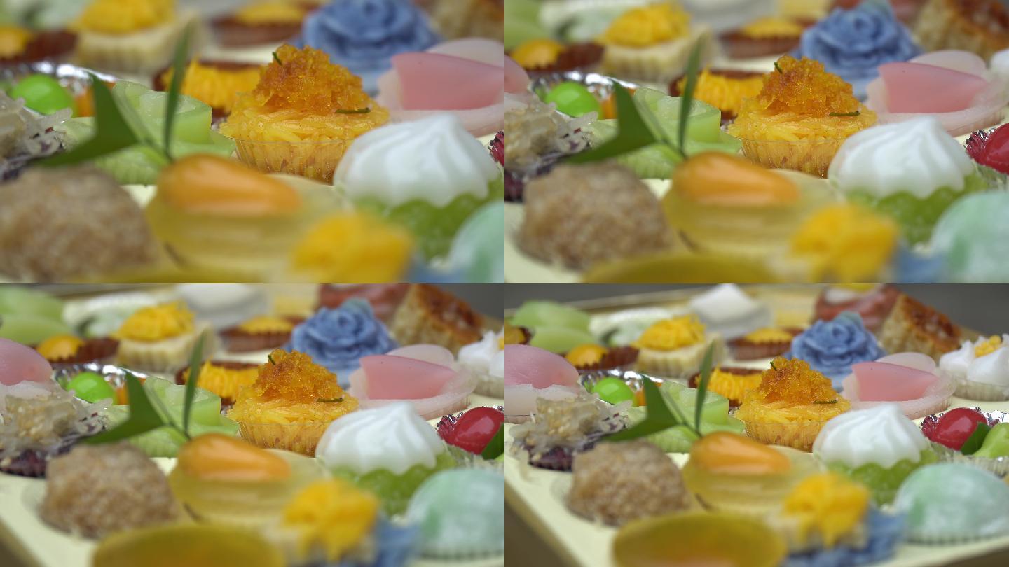 小杯子里供应的多色泰国甜点的极端特写侧视图。