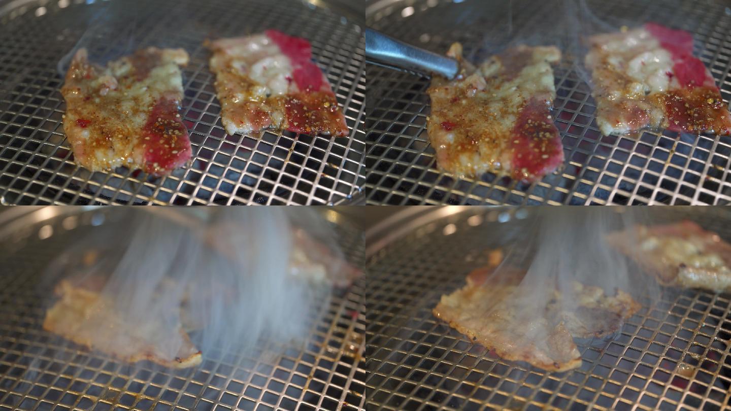 烤肉店里用火炭碳烤两片美味的肥牛片