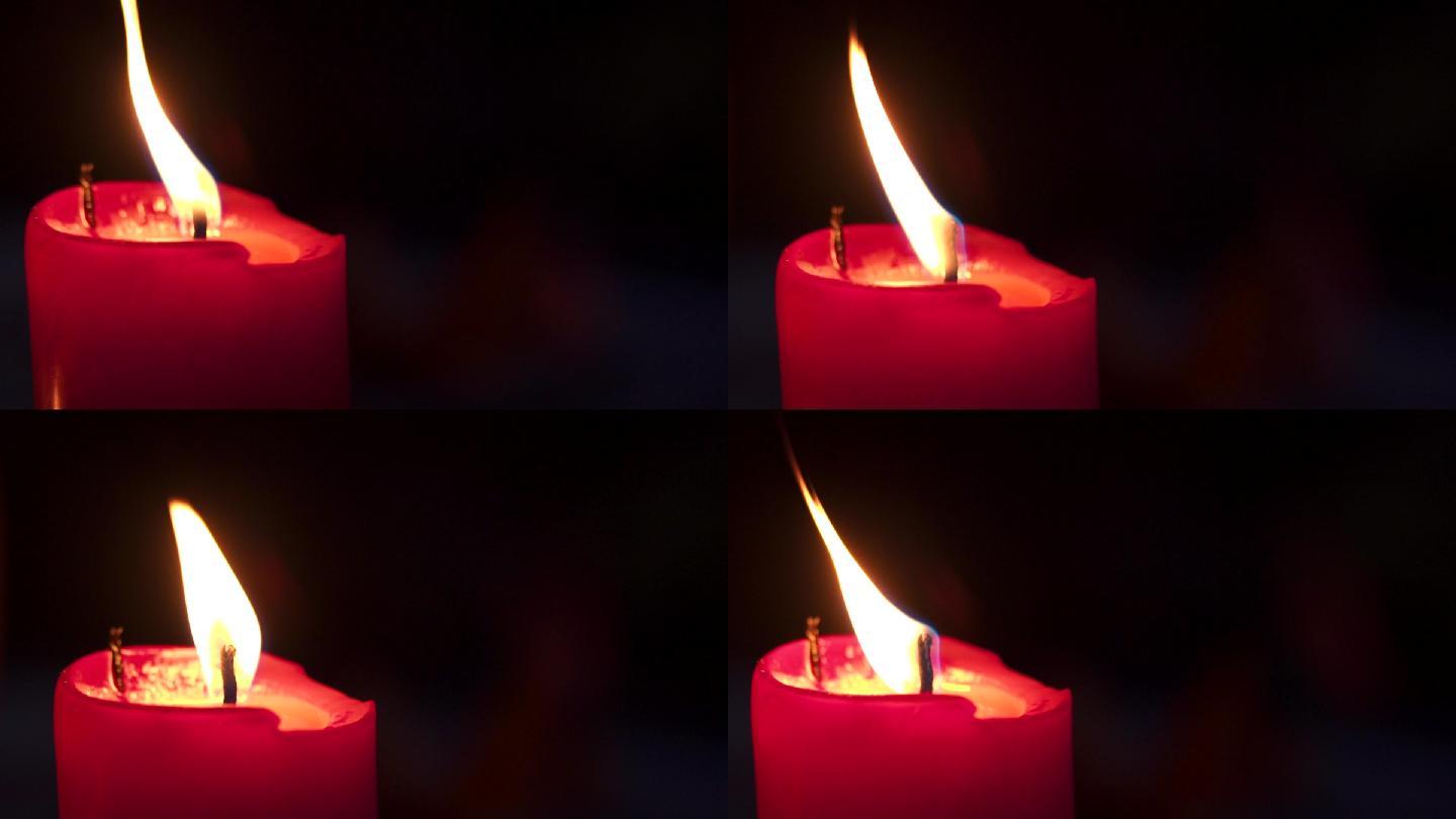 夜间燃烧的红烛火苗空镜头红色的火烛