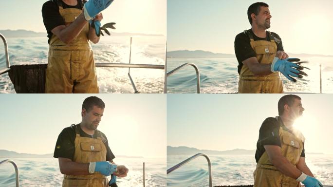 独立渔民在海上戴上工作手套