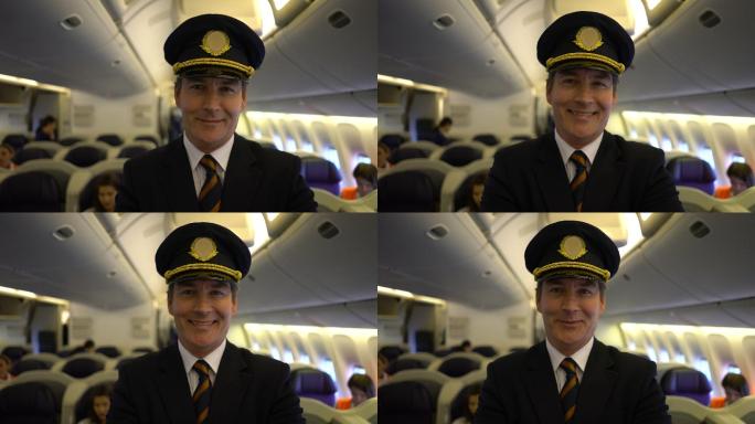 英俊的白人飞行员站在客舱，双臂交叉，对着摄像机微笑