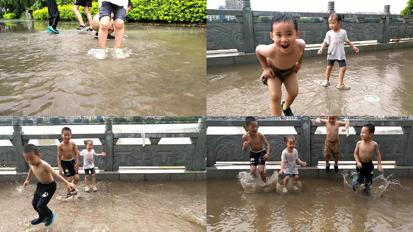 玩水跳水顽皮小孩闹小男孩雨中玩水站在雨水