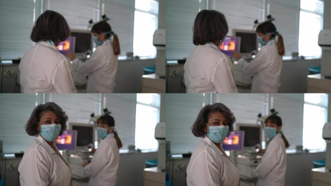 两名女医生在检查室使用口罩的照片