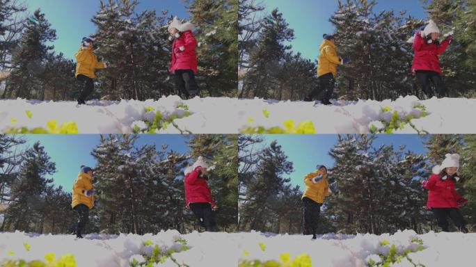 快乐儿童在雪地里打雪仗