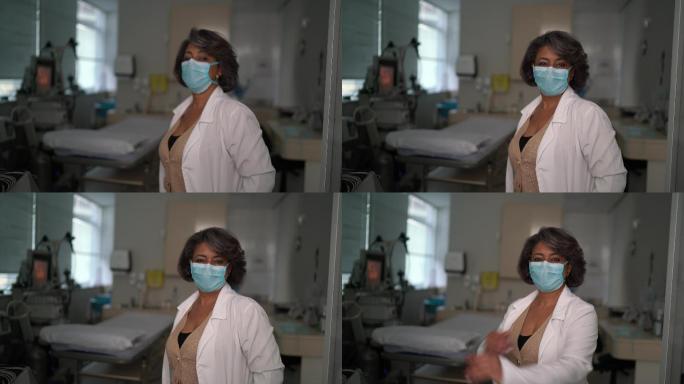 医院戴防护面罩的成年医生肖像