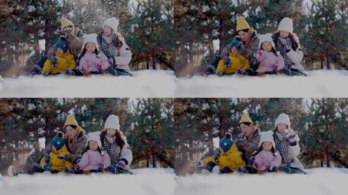 快乐家庭在雪地里玩耍