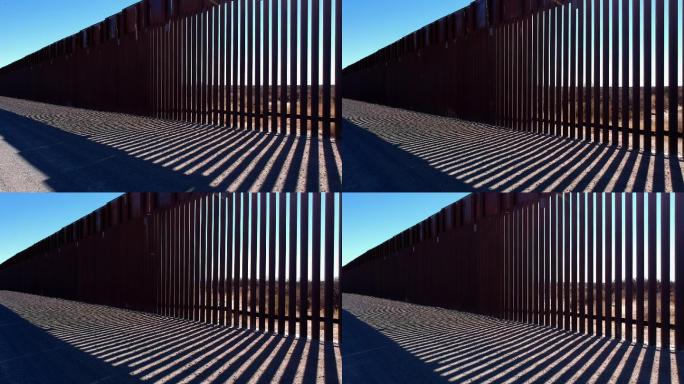 中午时分，无人驾驶飞机在美国附近的边境墙上飞越，墨西哥边境将德克萨斯州和Ciudad隔开，华雷斯-奇