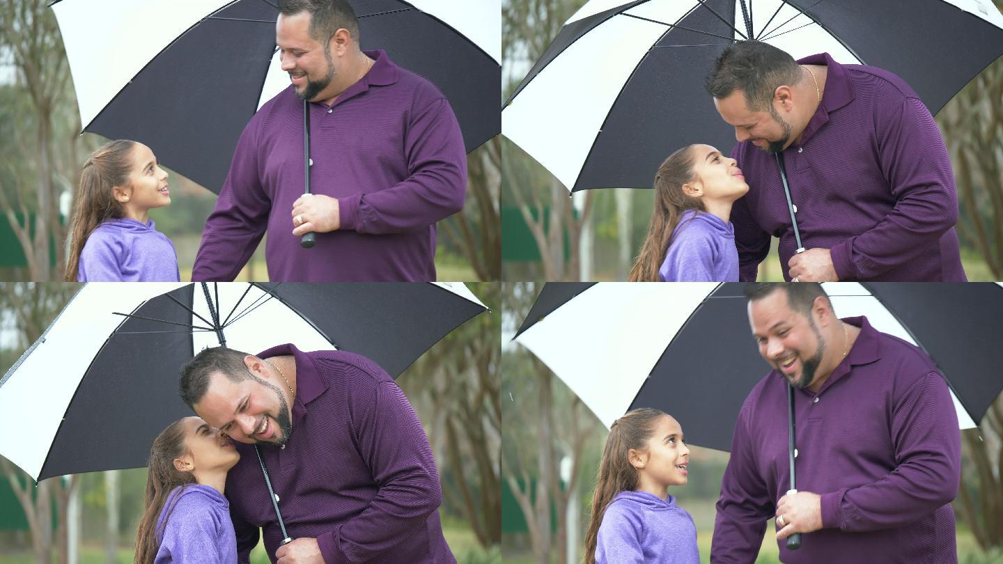 西班牙裔女孩，父亲雨天在雨伞下行走