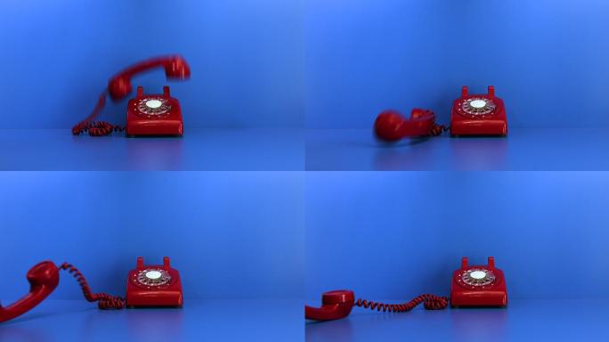 旧红色手机掉到蓝色背景下