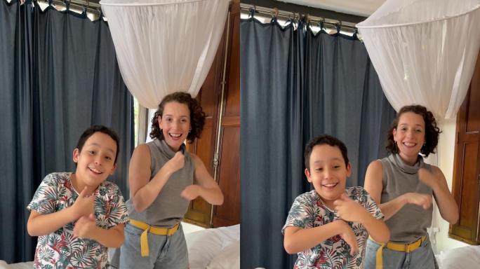 残疾母亲和儿子在家为社交媒体挑战而跳舞-残疾人-移动摄像头视角
