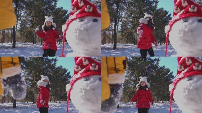 快乐儿童在雪地里打雪仗