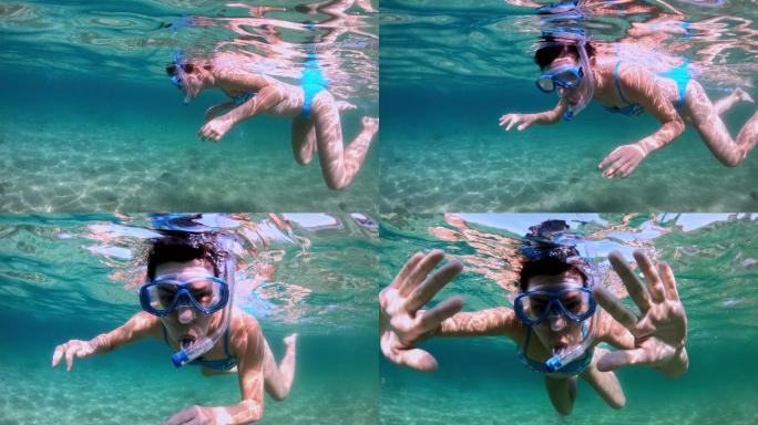 年轻女子在海上浮潜