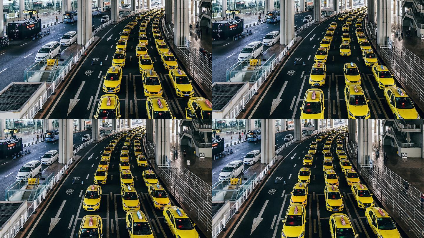 机场出口处，电汇盘繁忙的黄色出租车排队