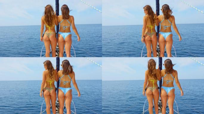 在海上的一个美好的日子里，斯洛·莫看到两个女人站在游艇的船头