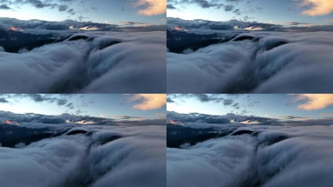 【4K正版】航拍日落阳光中的雪山云瀑