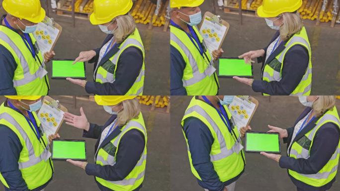 一对成年男女在仓库工作时使用绿色屏幕数字平板电脑的4k视频片段