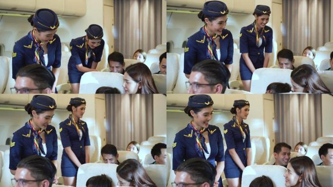 空姐在飞机上与乘客交谈