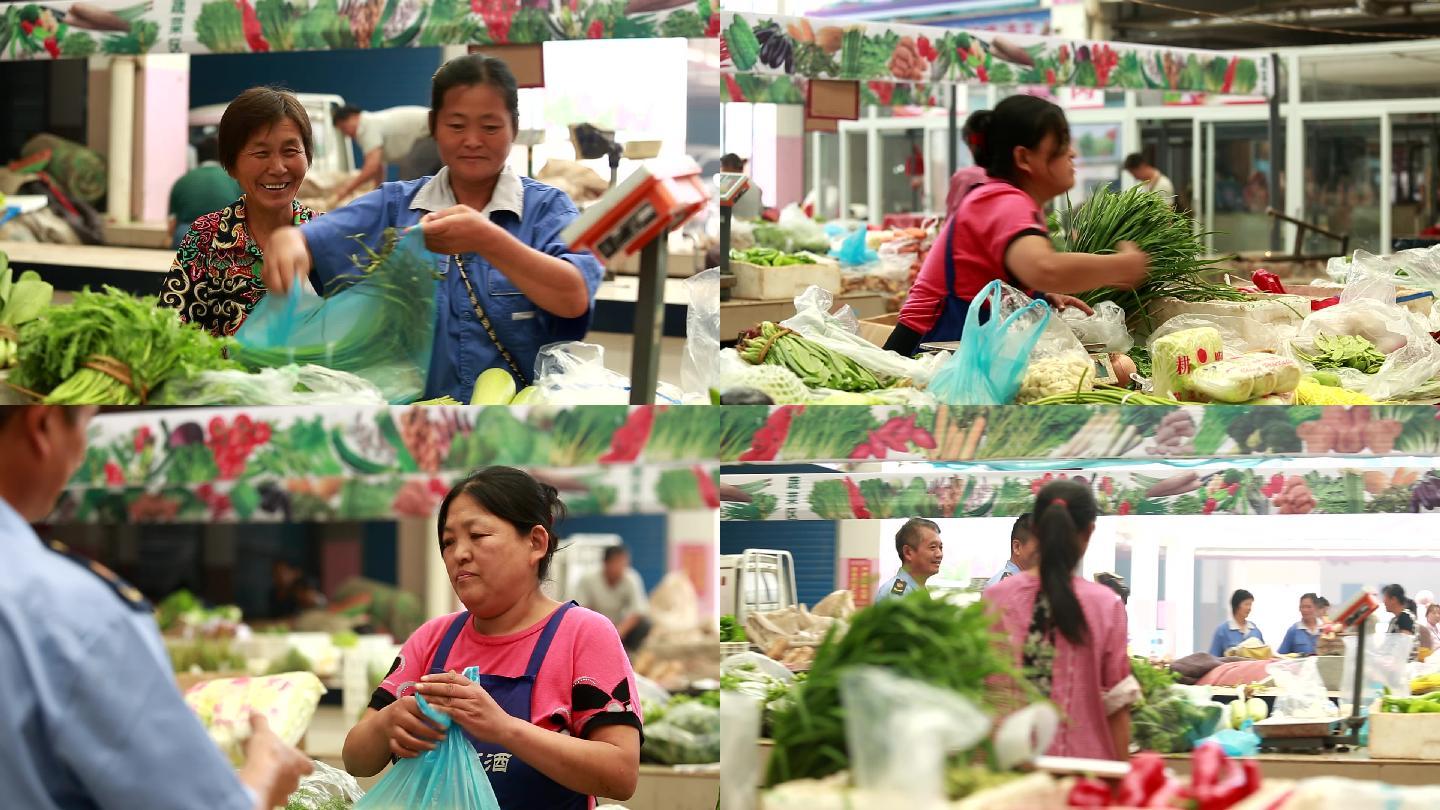 菜市场上的早市群众在购买蔬菜