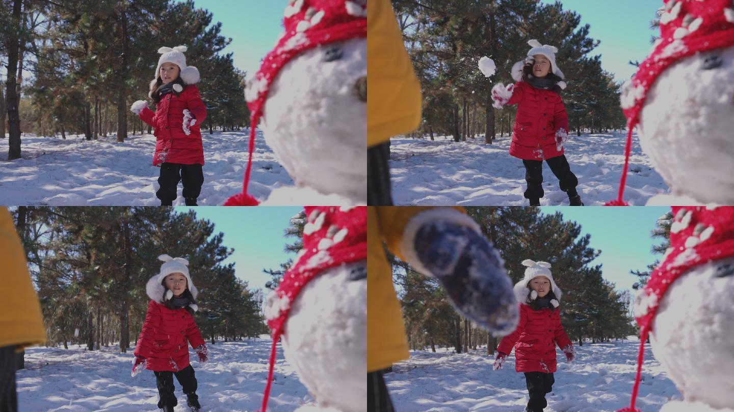 快乐儿童在雪地里打雪仗