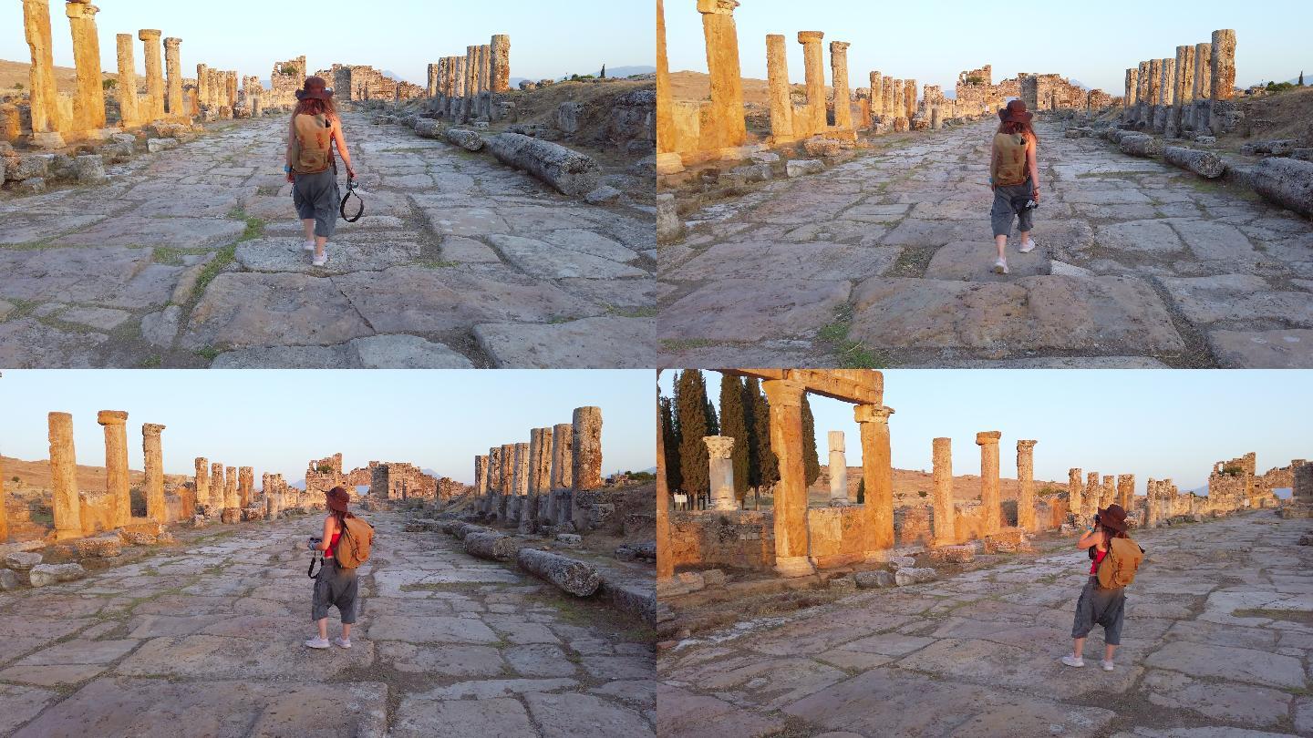 摄影师游客正走向帕穆卡勒希拉波利斯古遗址中的Frontinus门