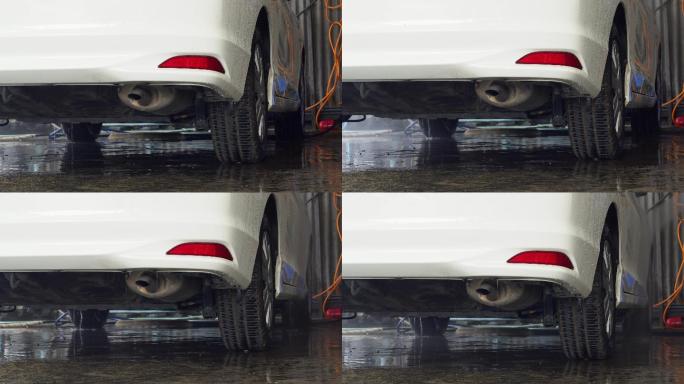 洗车，洗车。小车底盘视频素材小轿车尾气排
