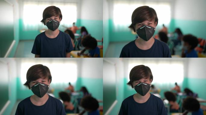 一个男孩在教室里戴口罩的肖像