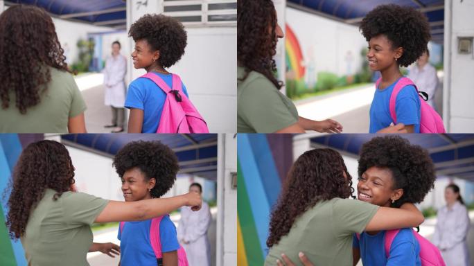 母女俩在学校门口互相拥抱