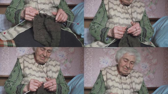 一位老年人编织精细美观，一位奶奶双手布满皱纹的特写镜头，正在制作一件新的冬季毛衣，积极的退休人员。