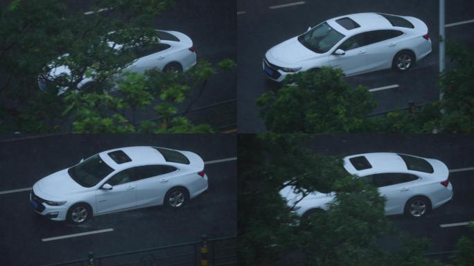 雨中行驶的白色轿车