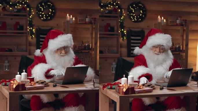 圣诞老人正在办公桌旁的笔记本电脑上工作，吃着牛奶饼干