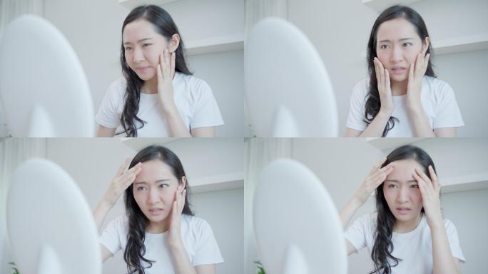亚洲年轻女性担心面部皮肤病和对化妆品中的类固醇过敏。皮肤敏感，面部晒伤导致面部发红。皮肤问题与美容。