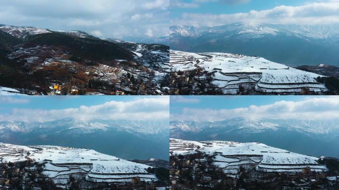 冬季阳光阴影白雪覆盖田野农村远处连绵雪山