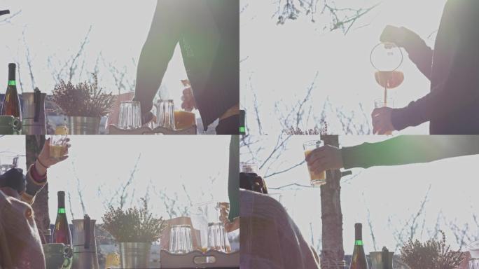 手持式照片显示，一个面目全非的男子给自己倒了一杯或橙汁，与朋友一起祝酒庆祝