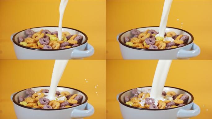 把牛奶倒在水果圈里，玉米片盛在碗里，超级慢动作